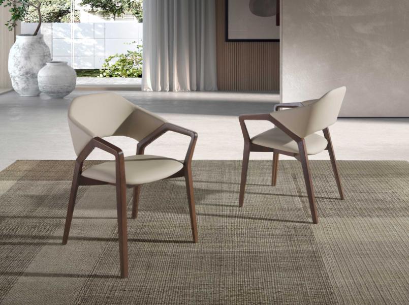 Chair upholstered in leatherette with Walnut colored wooden structure